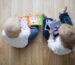 Children playing with wooden toys on a floor