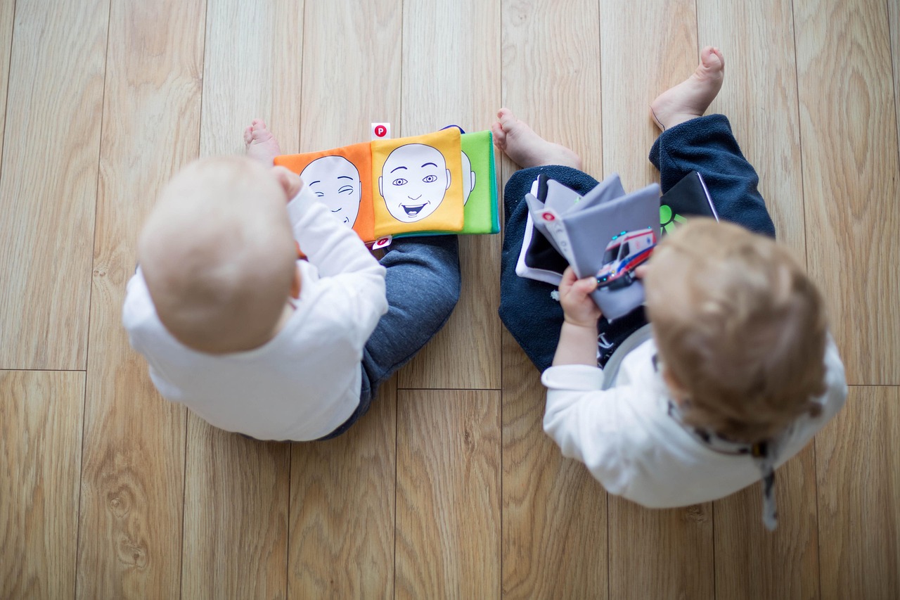 Children playing with wooden toys on a floor
